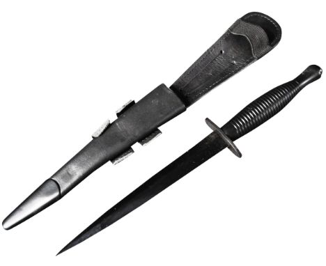 An original current issue FS Fairbairn Sykes British commando knife dagger. The knife having a nut to the pommel, ribbed hand