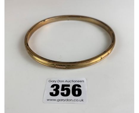 9k gold arm bangle, 3.75” diameter, w: 13.1 gms