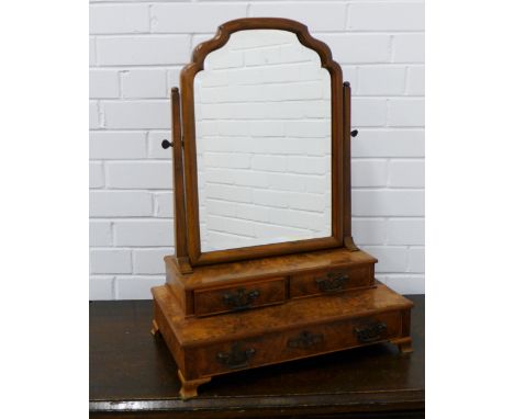 Walnut dressing  table mirror with serpentine top over two short drawers and two longer drawers, on ogee bracket feet, 47 x 6