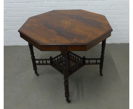 Victorian Aesthetic period rosewood table with octagonal top, ring turned legs and spindle gallery undertier, 71 x 23 x 47cm 