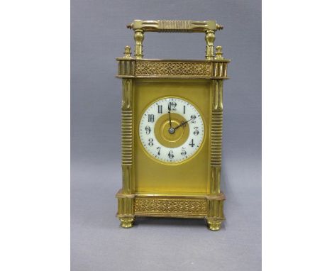 Late 19th century French brass carriage clock, the enamel chapter ring with Arabic numerals and within an ornate case, height