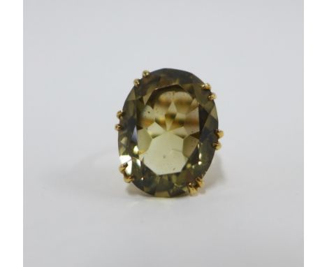 9ct gold smoky quartz dress ring, claw set oval stone in an open work setting,  Edinburgh 1972, UK ring size 