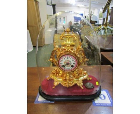 19th CENTURY FRENCH MANTEL CLOCK, richly gilded glass domed mantel clock with inset Sevres-style clock face, 27cm height 