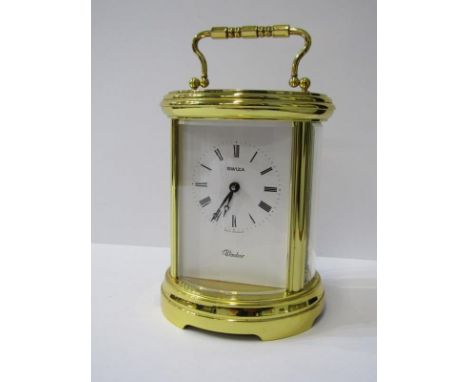 CARRIAGE CLOCK, oval brass cased bevelled glass carriage clock by Swiza with key, 13cm height 