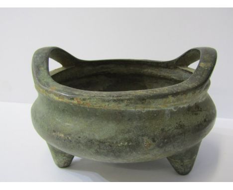 ORIENTAL METALWARE, a Chinese twin handled bronze tripod base temple censer, square seal mark base, 15cm diameter 