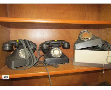 VINTAGE TELEPHONES, 2 black bakelite tabletop vintage telephones, together with box of spares 