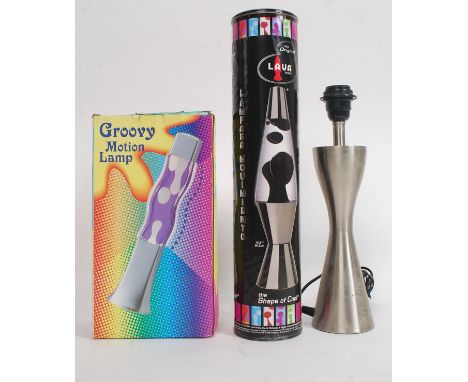 A collection of lamps to include boxed Lava lamps and a brushed aluminium lamp H47cm