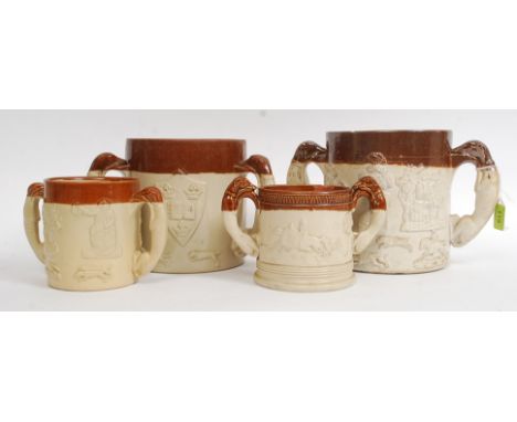 A collection of 4  large stoneware twin handled loving cups - jugs having hunting scenes with armorial shields horse and ride
