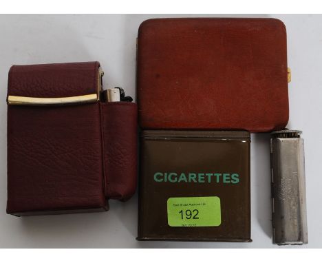 A vintage Army issue cigarette tin together with other cigarette leather cases etc and a cigarette rolling paper machine