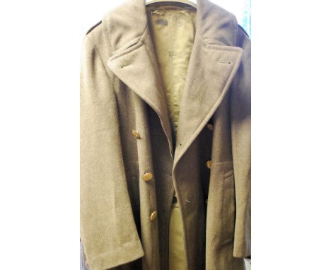 A 2nd World War American great coat having lined interior with clover army patch emblem to arm