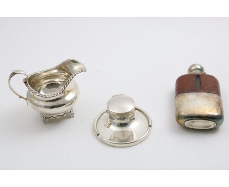 A GEORGE V MOUNTED GLASS SPIRIT FLASK with a pull-off cup and a leather-clad upper body, by James Dixon &amp; Sons, Sheffield