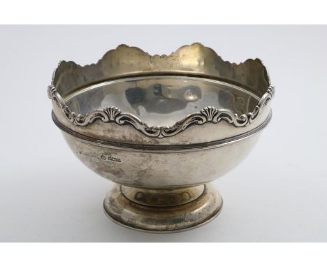 A GEORGE V ROSE BOWL with an undulating rim of shells and scrolls, a domed circular foot and a moulded girdle, by William Hut