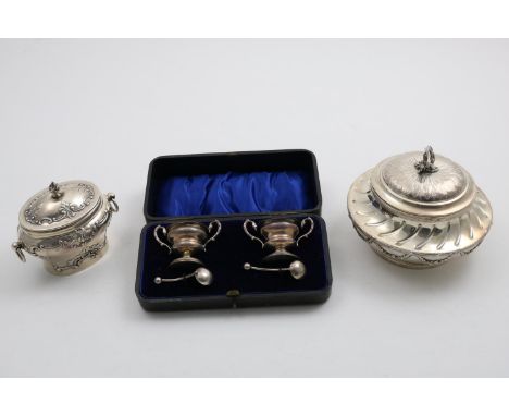 A LATE VICTORIAN OVAL TEA CADDY with drop-ring handles and embossed decoration, gilt interior, inscribed on the base, by Mess