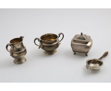A SMALL EDWARDIAN TEA CADDY gilt interior, a cream jug and matching sugar basin by Adie Brothers Ltd., Birmingham 1941 and a 