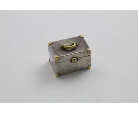 A LATE 20TH CENTURY NOVELTY GOLD-MOUNTED BOX resembling a small box or trunk with a simulated crocodile-skin finish, by Theo 