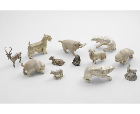 A SMALL VICTORIAN CAST FIGURE FINIAL in the form of a recumbent billy goat, another in the form of a stag and a third in the 