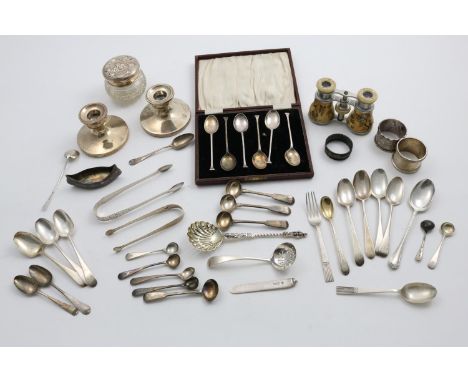 A MIXED LOT:- A mounted glass dressing table jar, a pair of dressing table candlesticks, loaded, three napkin rings, a small 