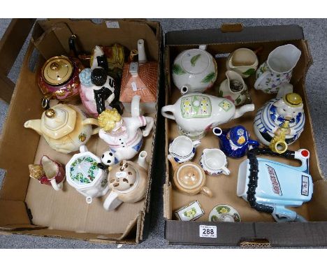 A collection of novelty teapots to include tango dancing, footballer, elephant, Wade, etc. (2 trays)