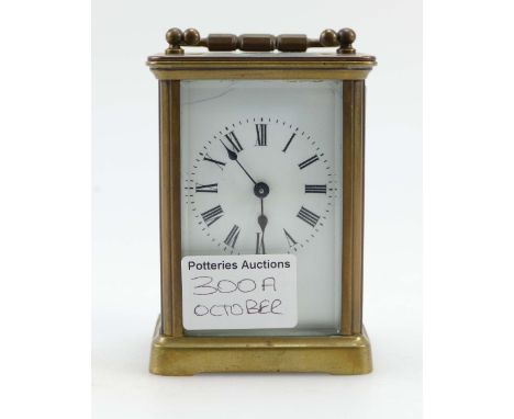 19th Century small brass carriage clock, small crack to enamel dial and needs attention to the movement, height 10.5cm.