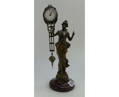 A bronze figural clock of lady holding the pendulum, height 34cm.