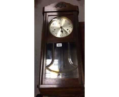 Edwardian oak wall clock.