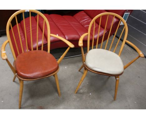 A pair of Ercol Windsor elm carvers. (2)