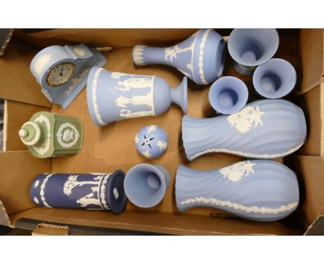 A collection of Wedgwood Jasperware items to include footed vases, clocks, bowls, tea caddy, etc. 