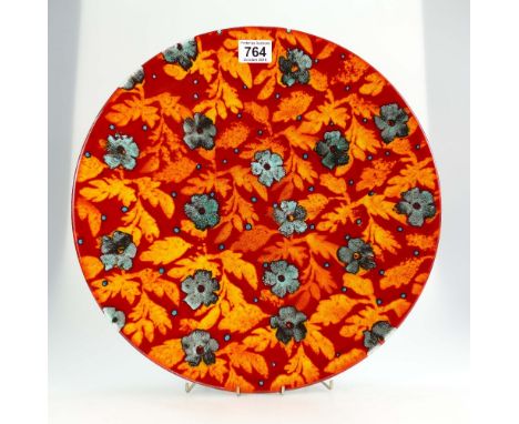 Poole pottery Studio charger decorated with blue flower heads with ornage/red ground, signed Janice Tchalenko 1999, diameter 