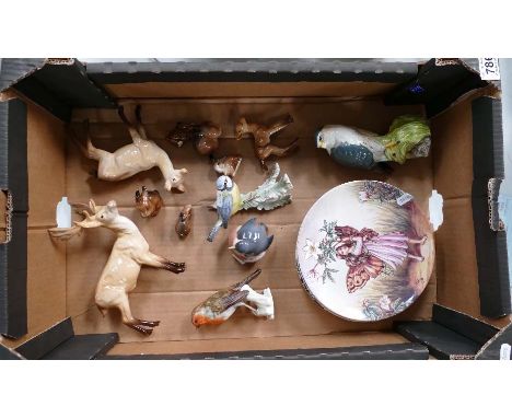 A collection of Beswick animals comprising Stag family, Rabbit family, Merlin decanter, Royal Copenhagen chick, Goebel birds 