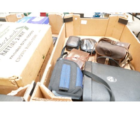 A mixed collection of items to include cameras, binoculars, digital cameras, early boxed Crown recorder cassette player. (2 t