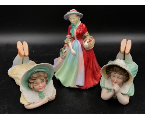 A pair of early 20thC bisque piano dolls along with a Paragon figurine "Lady Marilyn" 19cm h. 