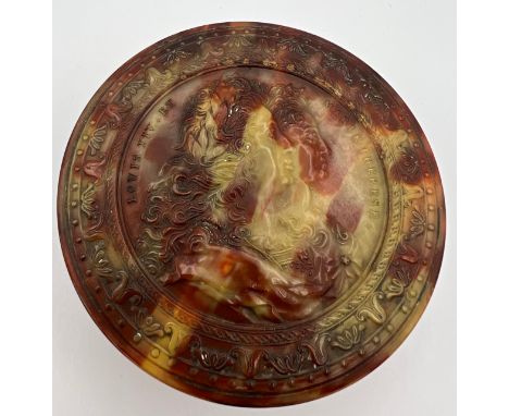 A superb quality pressed blond tortoiseshell snuff box depicting Louis XIV et Marie Therese. 8cm d. 