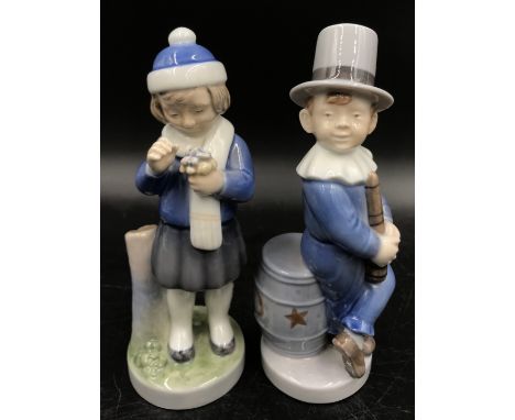 Two Royal Copenhagen monthly figures, boy juggler no. 4524 February 18 h and Girl with small flowers no. 4525 March 17.5cm h.
