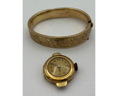 A 9 carat gold bangle together with a 14 carat gold cased ladies wrist watch. Total weight 37.4gm. Bangle 23.3gm. Watch 14.1g