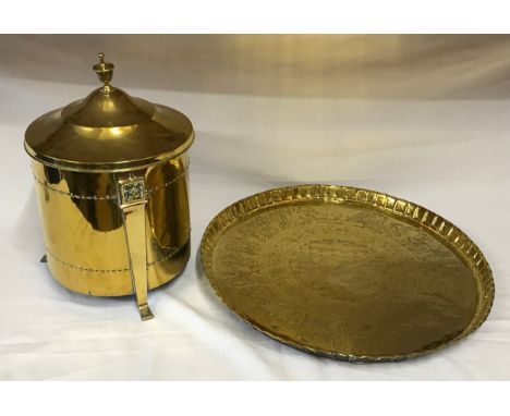 A large brass table top with Egyptian style decoration measuring 61cm in diameter along with a brass coal bucket with lid, fi