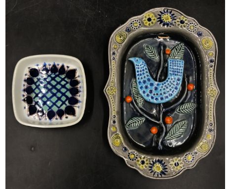 A late 20thC Arklow Pottery wall plaque designed by John F French, relief moulded with a bird in a tree in a floral border 25