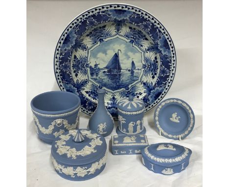 A collection of Wedgwood Jasperware to include a planter, four lidded pots a vase and a plate along with a delft plate depict