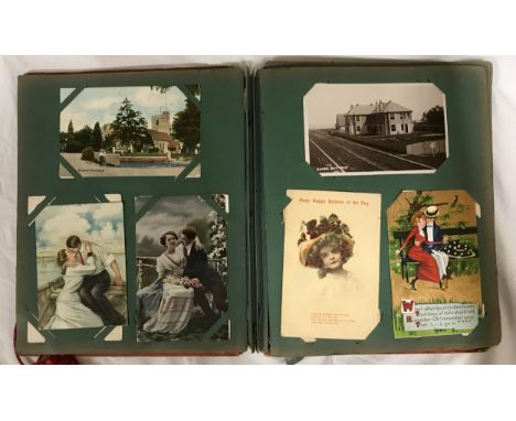 An album of old postcards to include several from 1914 with coded messages, humorous cards, topographical of Herne Bay, Strat