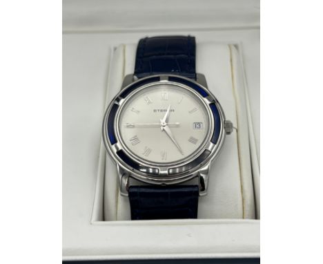 A Gentleman's Galaxis Eterna Blue Sapphire Bezel silver dial bracelet watch. Case diamter. 32mm. 