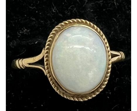 A nine carat gold ring set with opal. Total weight 1.7gm. Size O. 