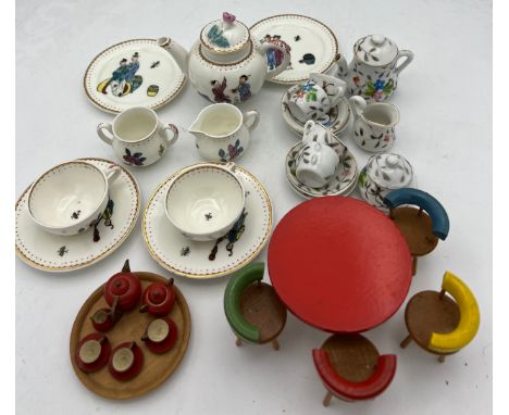 Two miniature tea services and a vintage wooden dolls house table 8cm d, chairs and tea service. To include Royal Worcester r