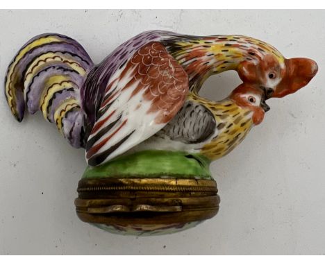 An 18/19thC continental porcelain cock and hen snuff box. 