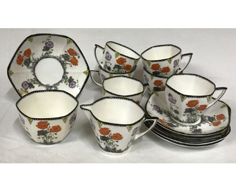 A Foley Bone China 'Field Poppy' design part tea service consisting of 6x cups, 6x saucers 12.5cm d, a sugar bowl and a jug. 
