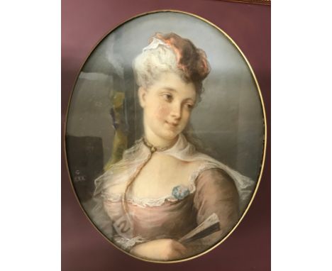 A 19thC oval pastel portrait of a lady in a pink dress, 24cm x 19cm, glazed in dull gilt frame. Marked G.XXX. Image size 58 x