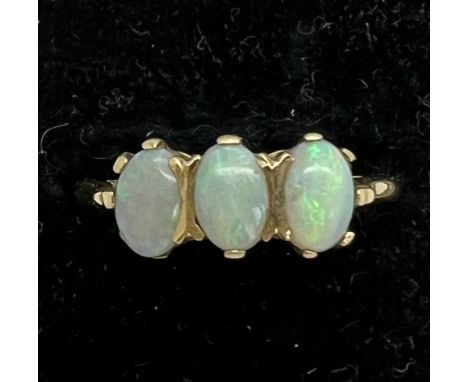 A three stone opal ring set in 9ct gold. Total weight 2.2gm. Size P.