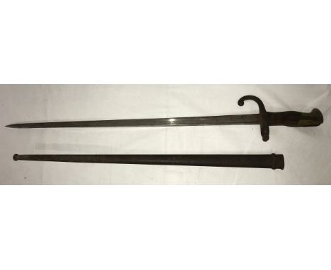 A Sword Bayonet with the words Mre d’ Armes de St. Etienne on the edge of the blade, with scabbard, blade length 52cm. 