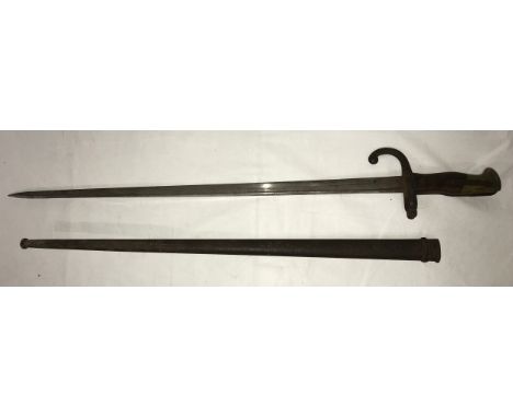 A Sword Bayonet with the words Mre d’ Armes de St. Etienne on the edge of the blade, with scabbard, blade length 52cm. 