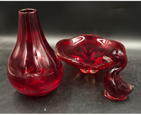 Three pieces of Whitefriars ruby glass to include an Onion Vase 22cm h, Dilly Duck and a Geoffrey Baxter (1922-1995) Bowl pat