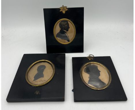 Three 19thC oval portrait silhouettes in similar ebonised fames. 14 x 16cms. One inscribed John Hall Smith 1819. 