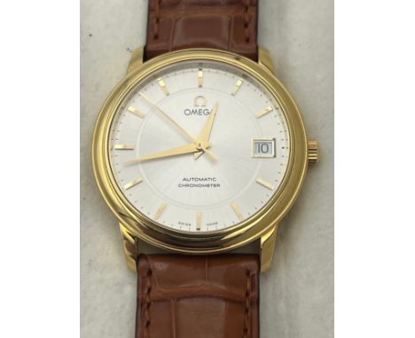 A boxed gentleman's 18ct gold omega automatic chronometer wristwatch. marked 750 to back, silver face, case diameter measures